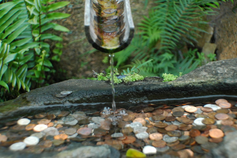 Joe Dobrow photo of coins in a fountain